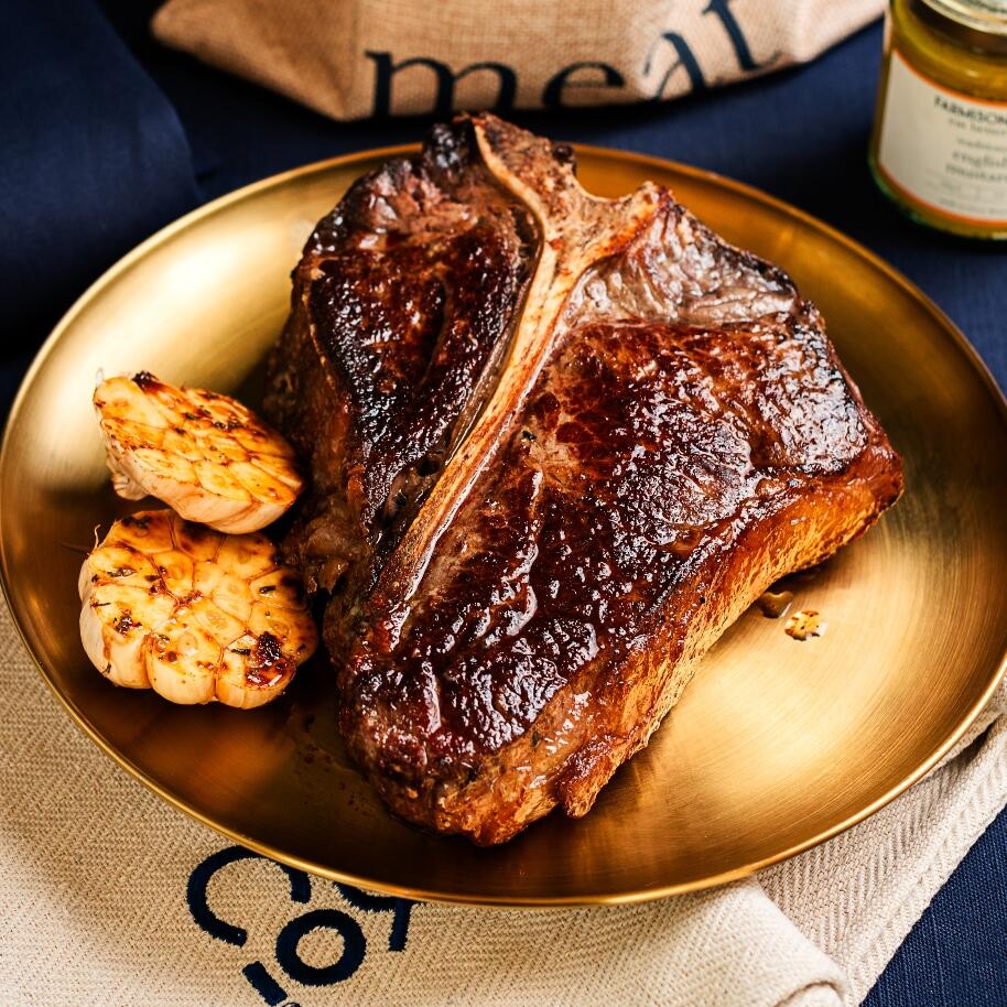 T bone steak cooked with charred garlic